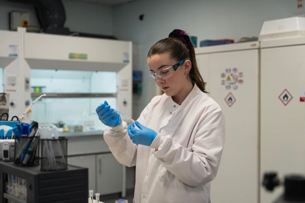 Female scientist testing crop protection products in a laboratory