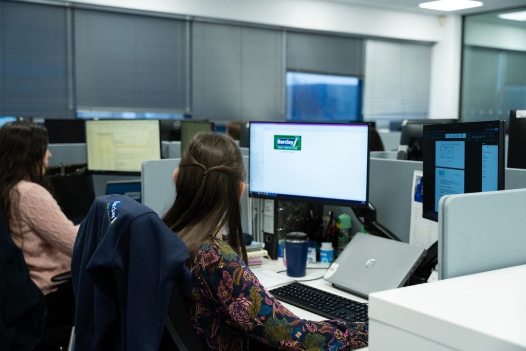 Woman working on a computer in an office environment